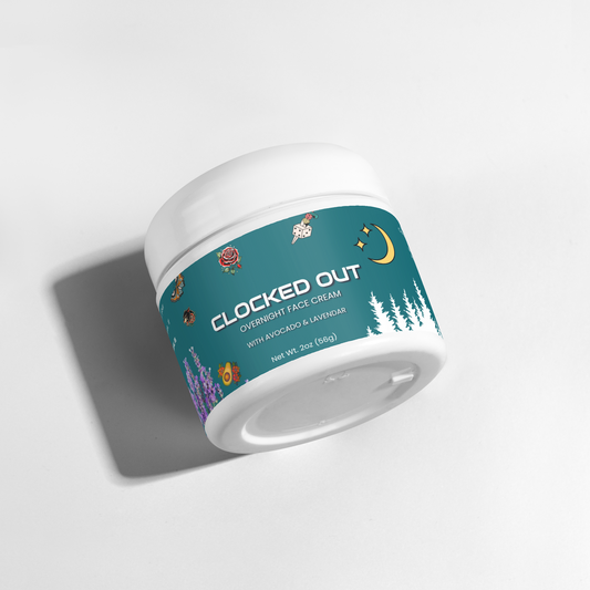 A white plastic jar of 'CLOCKED OUT' Overnight Face Cream with a teal label featuring moon, flower, and tree illustrations, photographed on a clean white background with a soft shadow.