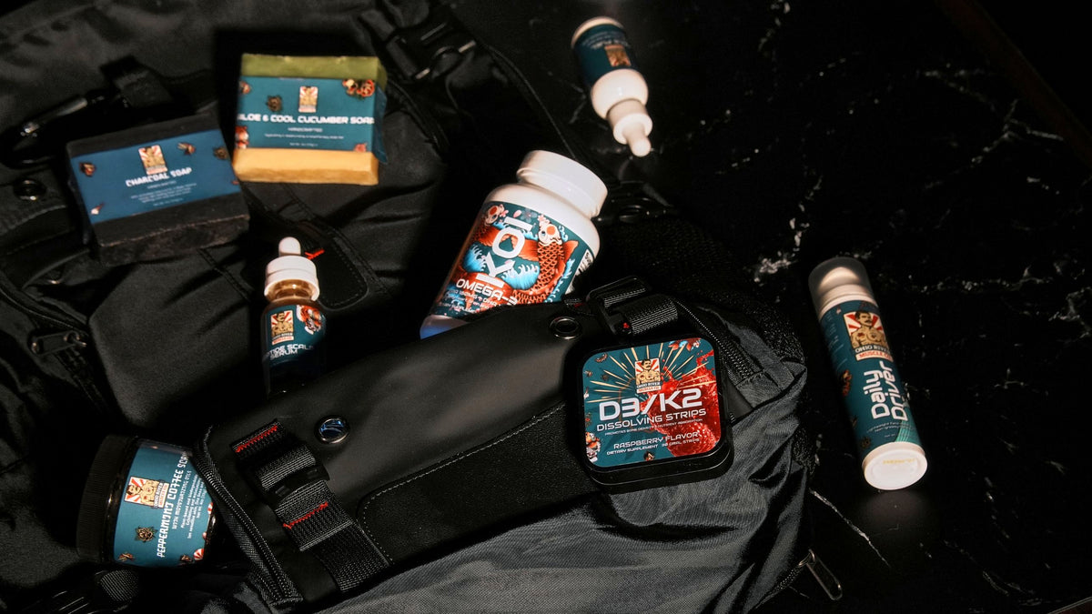 Ohio River Muscle Co. lineup in an open gym bag: KOI, D3 + K2, Daily Driver, Peptide Scalp Serum, Peppermint Coffee Scrub and bar soaps